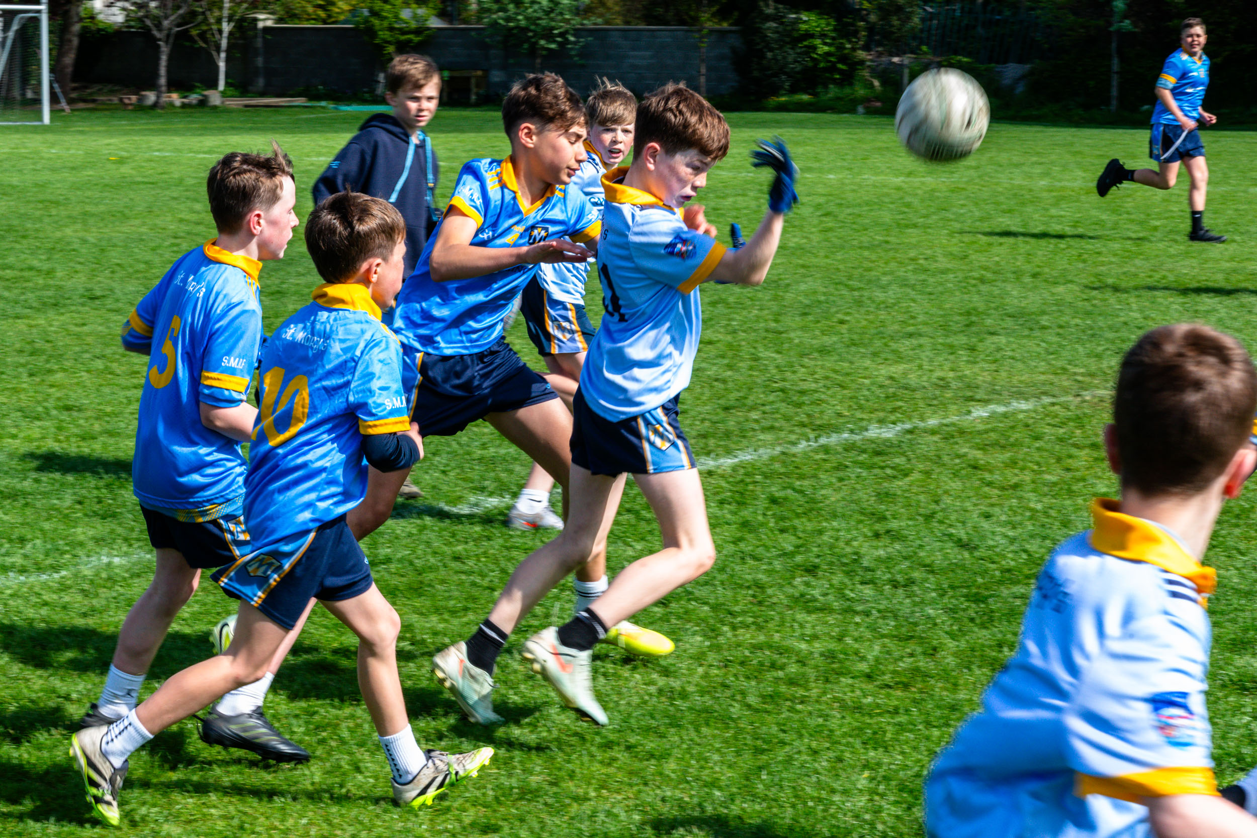 Pupils playing Gaelic football.